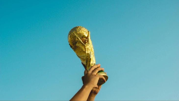 Lifting the world cup trophy in the air