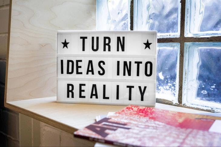 Message on signboard: 'Turn Ideas into Reality"
