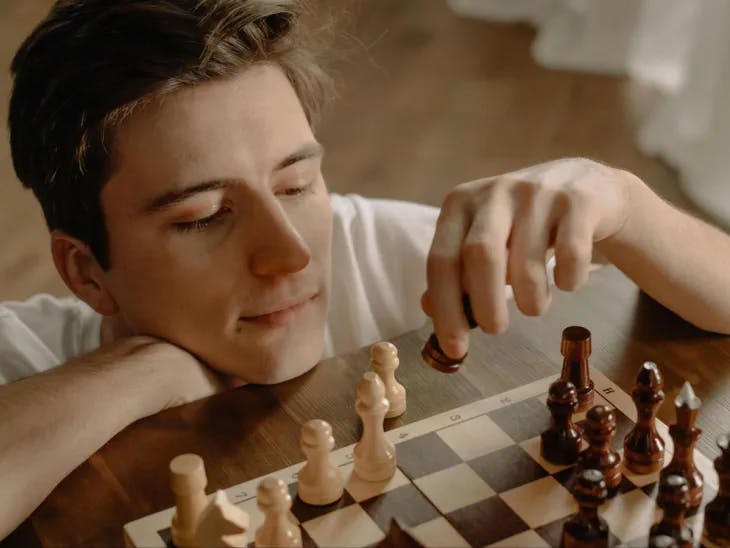 Boy playing chess