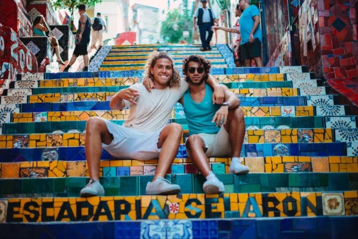 Two men sitting on stairs