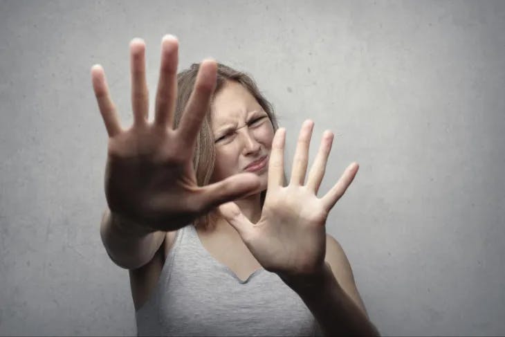 Woman saying no using hand gestures