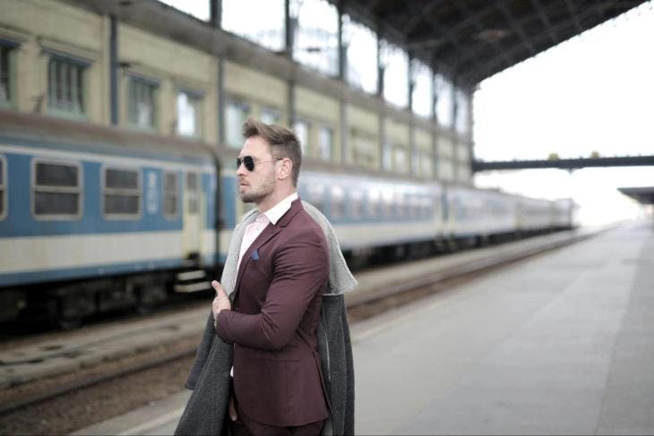 A man standing on a train station