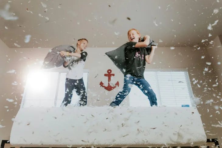 Kids having a pillow fight