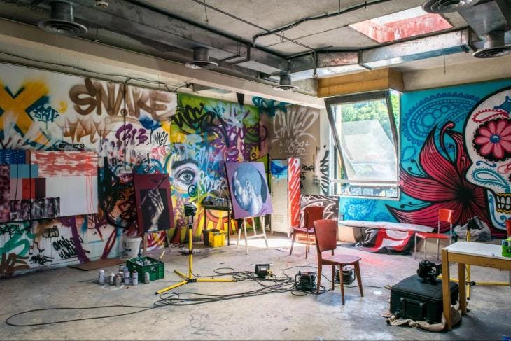 Art studio with graffiti and paintings