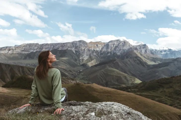 Woman enjoying the fresh mountain air