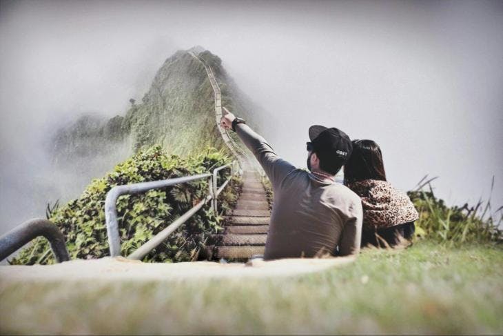 A couple with a mountaintop view