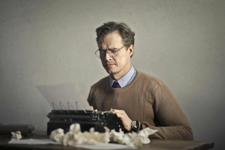 Man using a typewriter