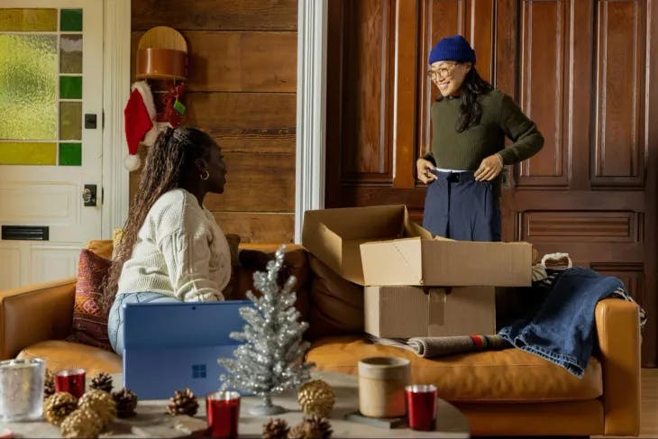 Two women unpacking decorations