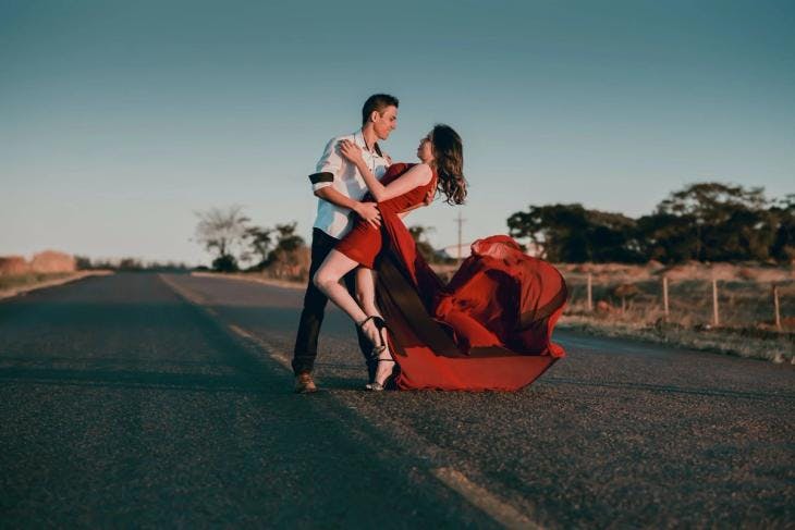 Couple dancing in the middle of the road