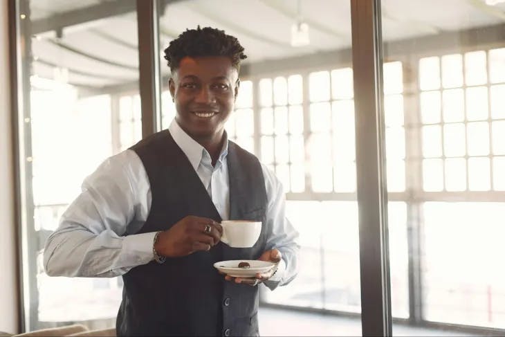 A man holding a cup of coffee