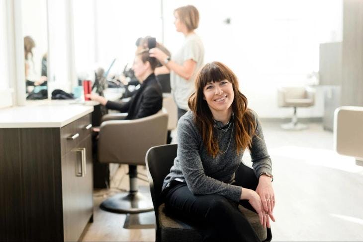 A woman sitting in a beauty salon 